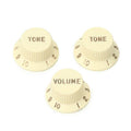 Fender strat knobs, left-handed, 1V + 2T, aged white
