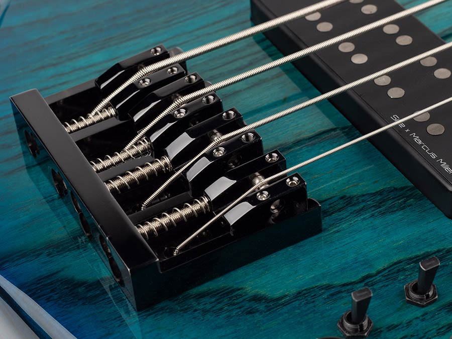 Sire M5+ S4 Marcus Miller 4-snarige actieve basgitaar transparent blue